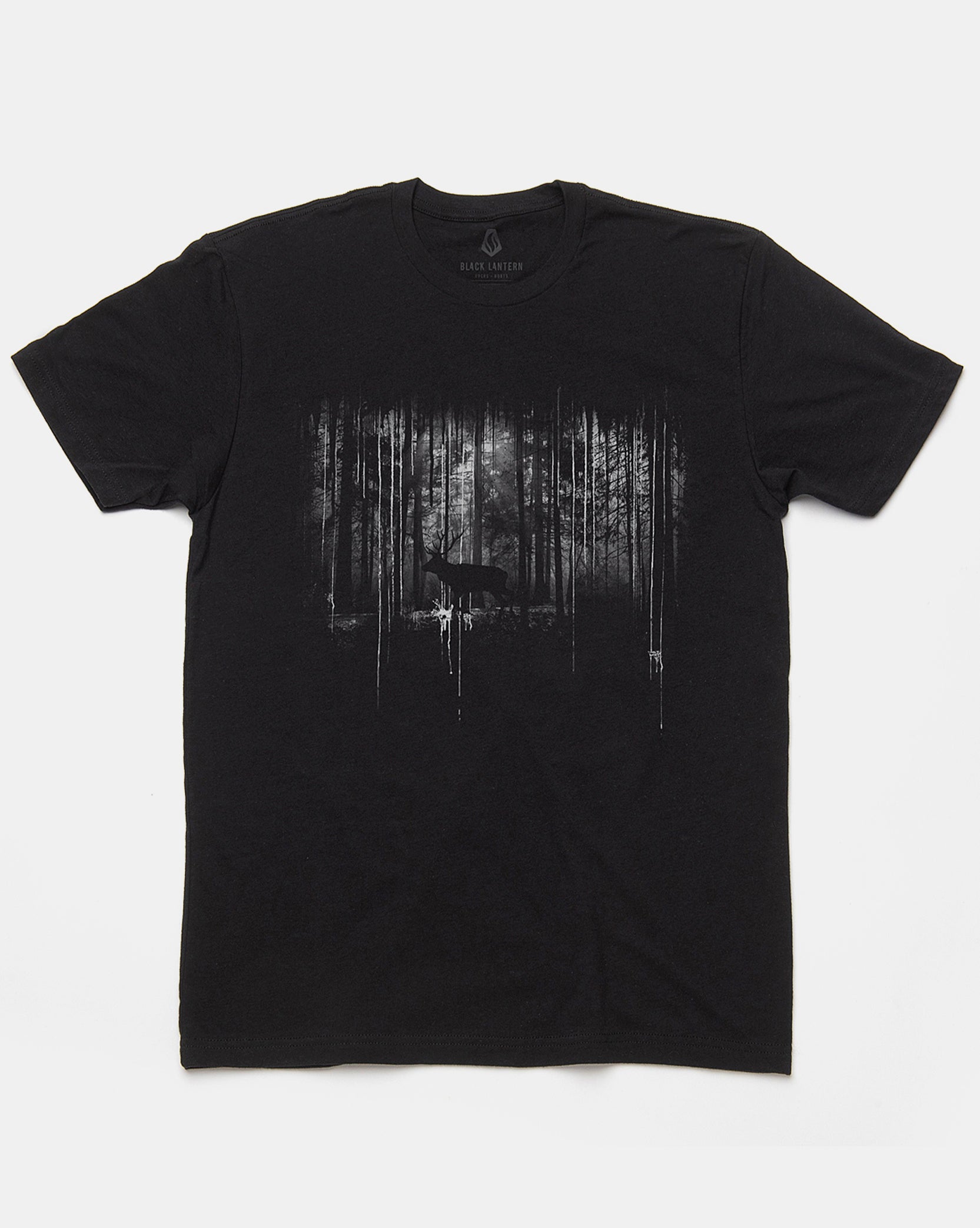A black short-sleeve crewneck t-shirt featuring a distressed, high-contrast graphic print of a deer in a forest on the front, displayed flat against a light gray background.