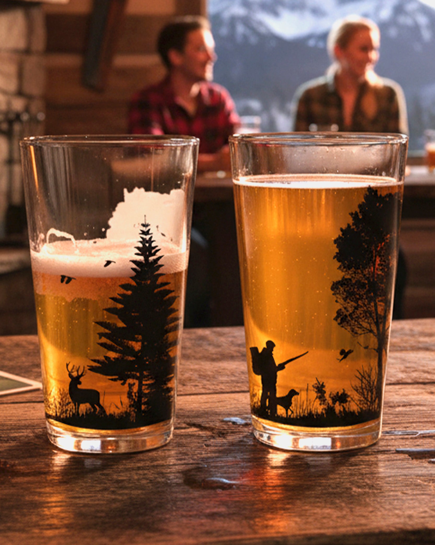 Hunting Themed pint glasses lifestyle image in a mountain bar