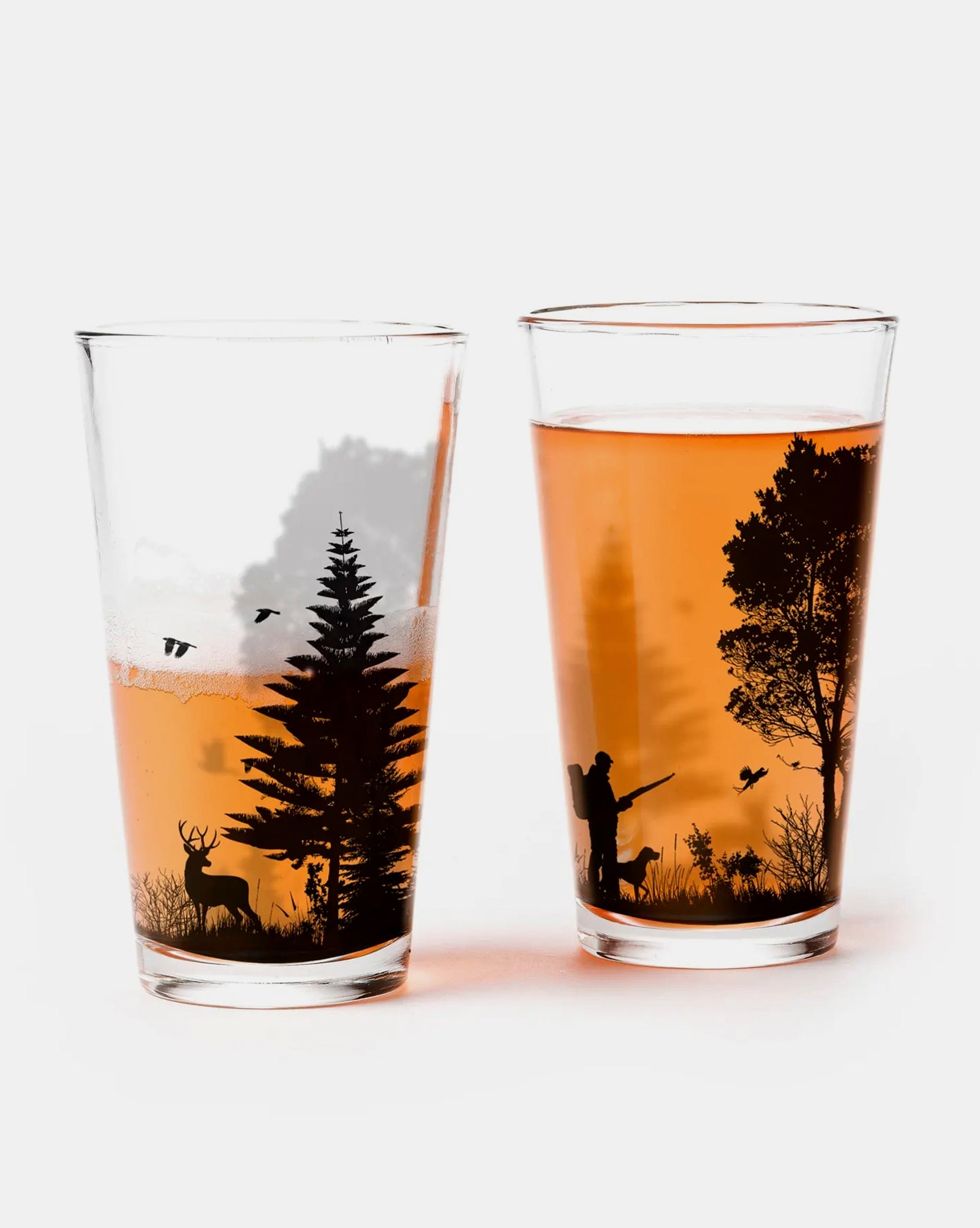 Two glasses with hunting-themed designs on a white background