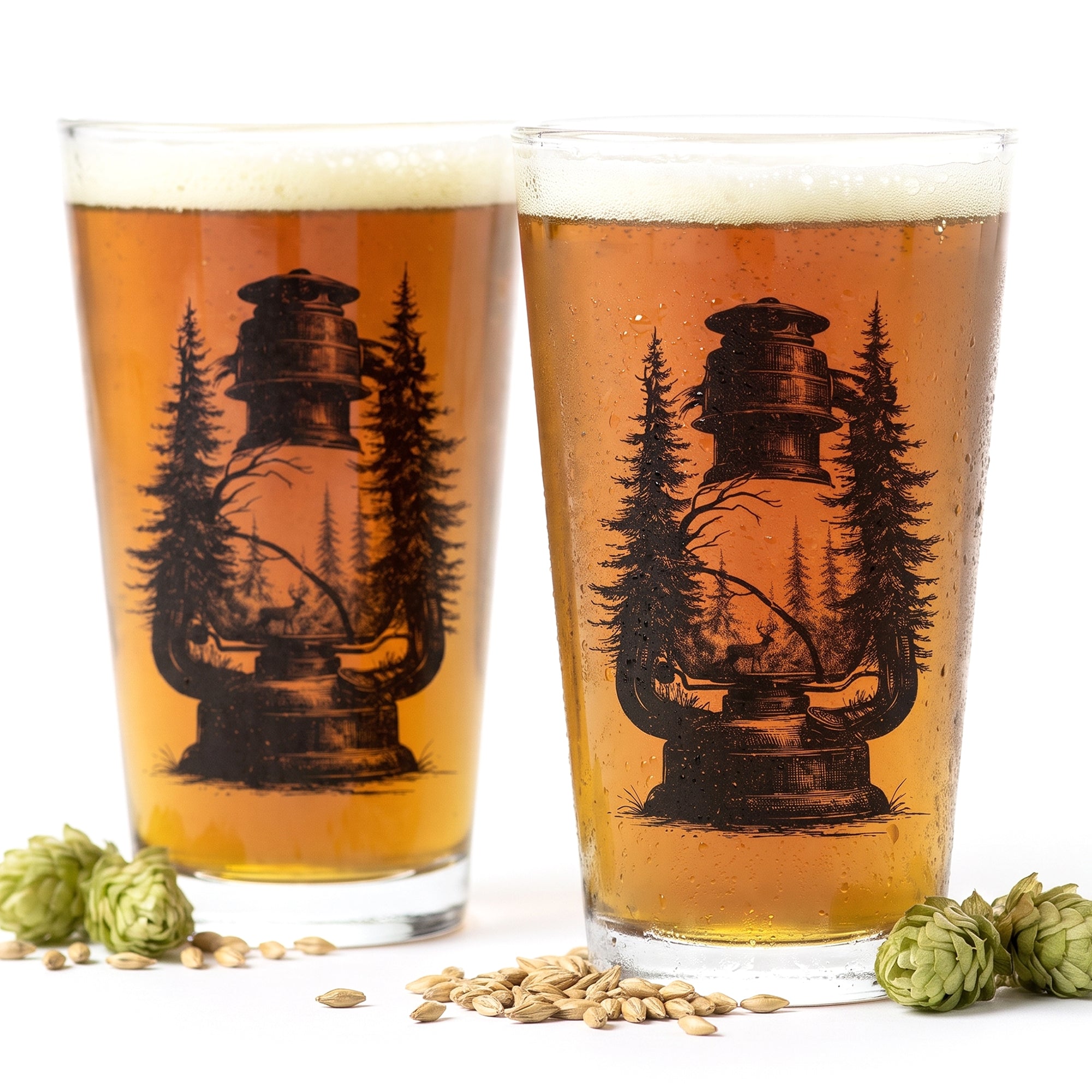 Lantern and Forest Hand Printed pint glasses surrounded by hops and grains on white background